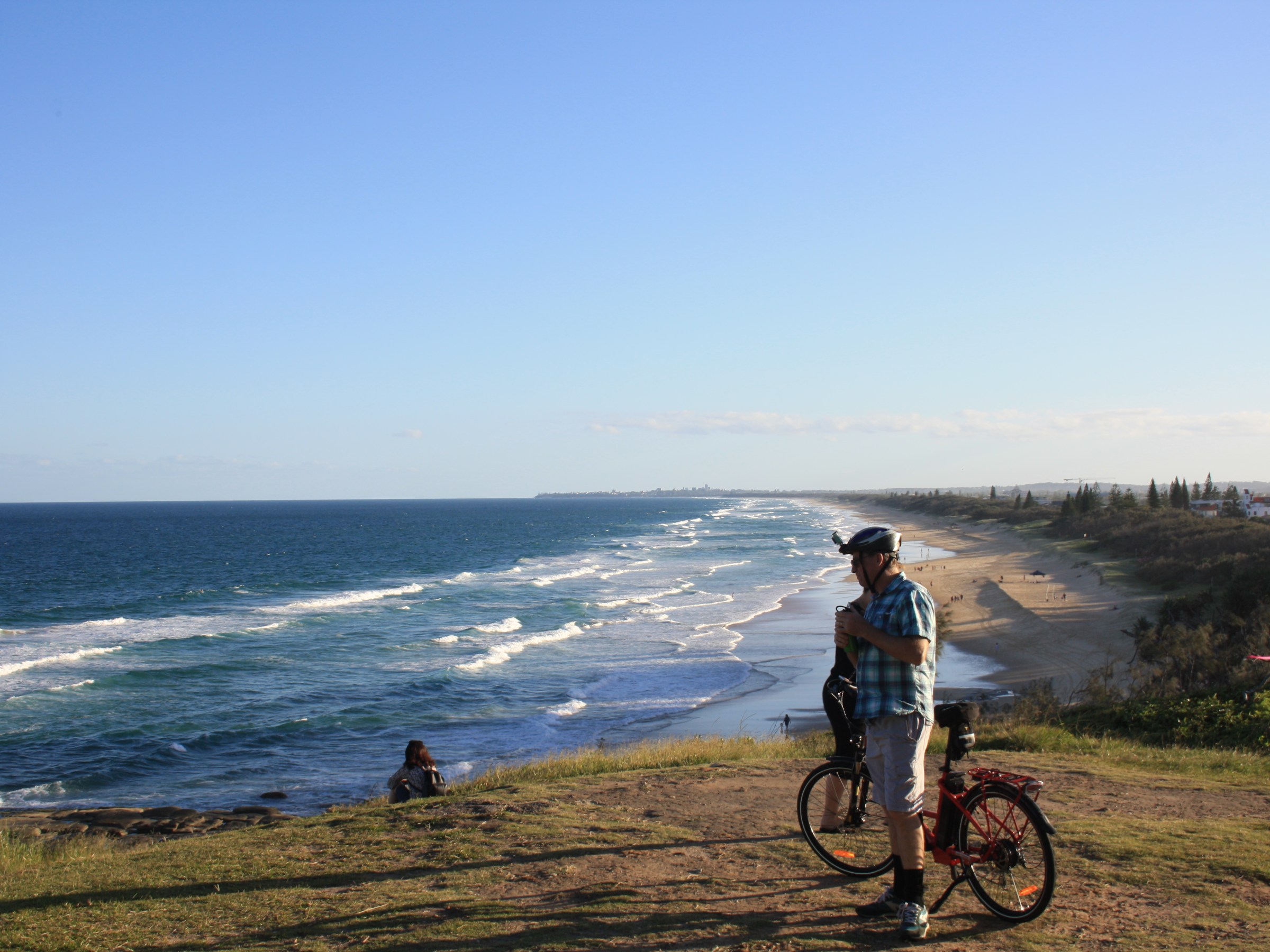 EcoTekkSC owner Stuart stops to contemplate life while enjoying expansive views from Point Cartwright Lookout during an e-bike ride along the Coastal Pathway.