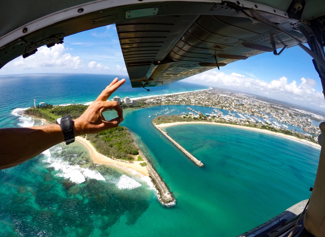Breathtaking view of the Mooloola River and Pt Cartwright from the open cabin of a Paradise Seaplane during a Warbird Seaplane adventure.
