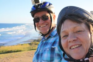a person wearing a hat and smiling at the camera