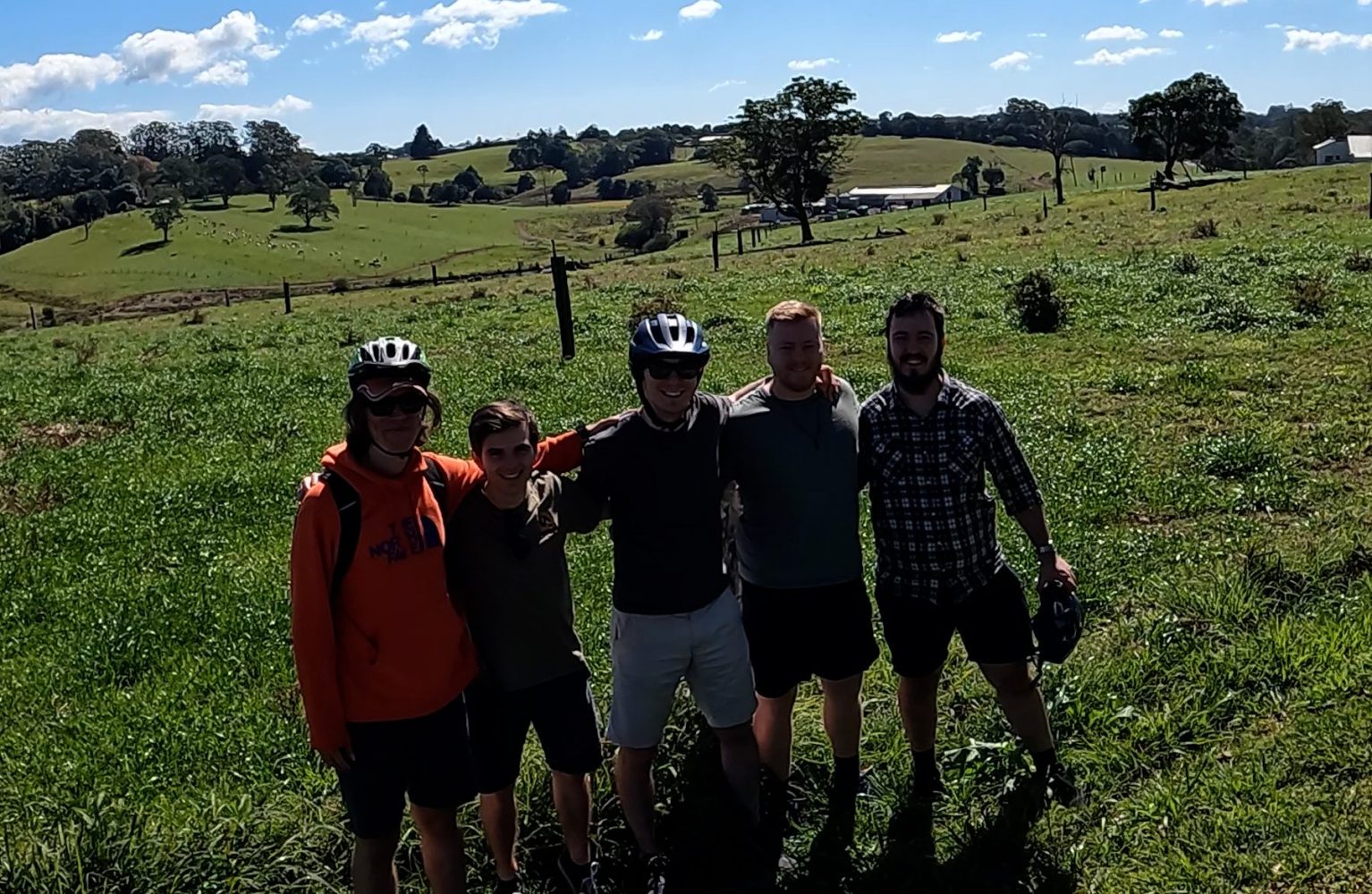 Five friends on the Maleny Magic e-Bike Tour enjoying a Buck’s Weekend ride through Maleny’s rolling hinterland fields