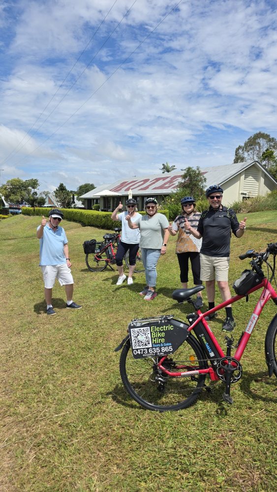 Happy group of five exploring Maleny on a guided e-bike ride through the hinterland