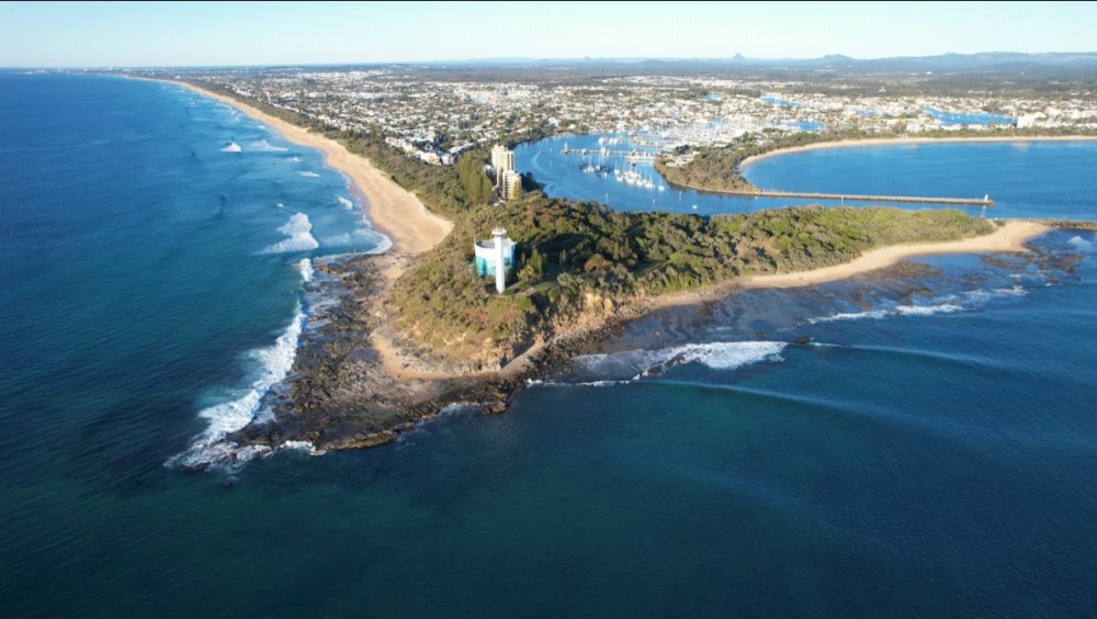 Aerial view of Point Cartwright with Mooloolaba Harbour, Kawana Beach and the Glasshouse Mountains beyond
